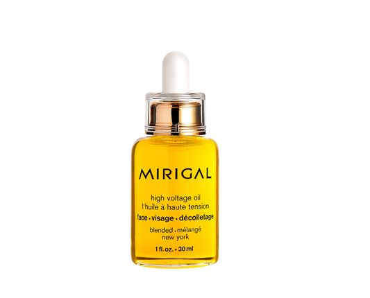 Yellow skincare oil bottle with dropper labeled 'Mirigal' on a white background